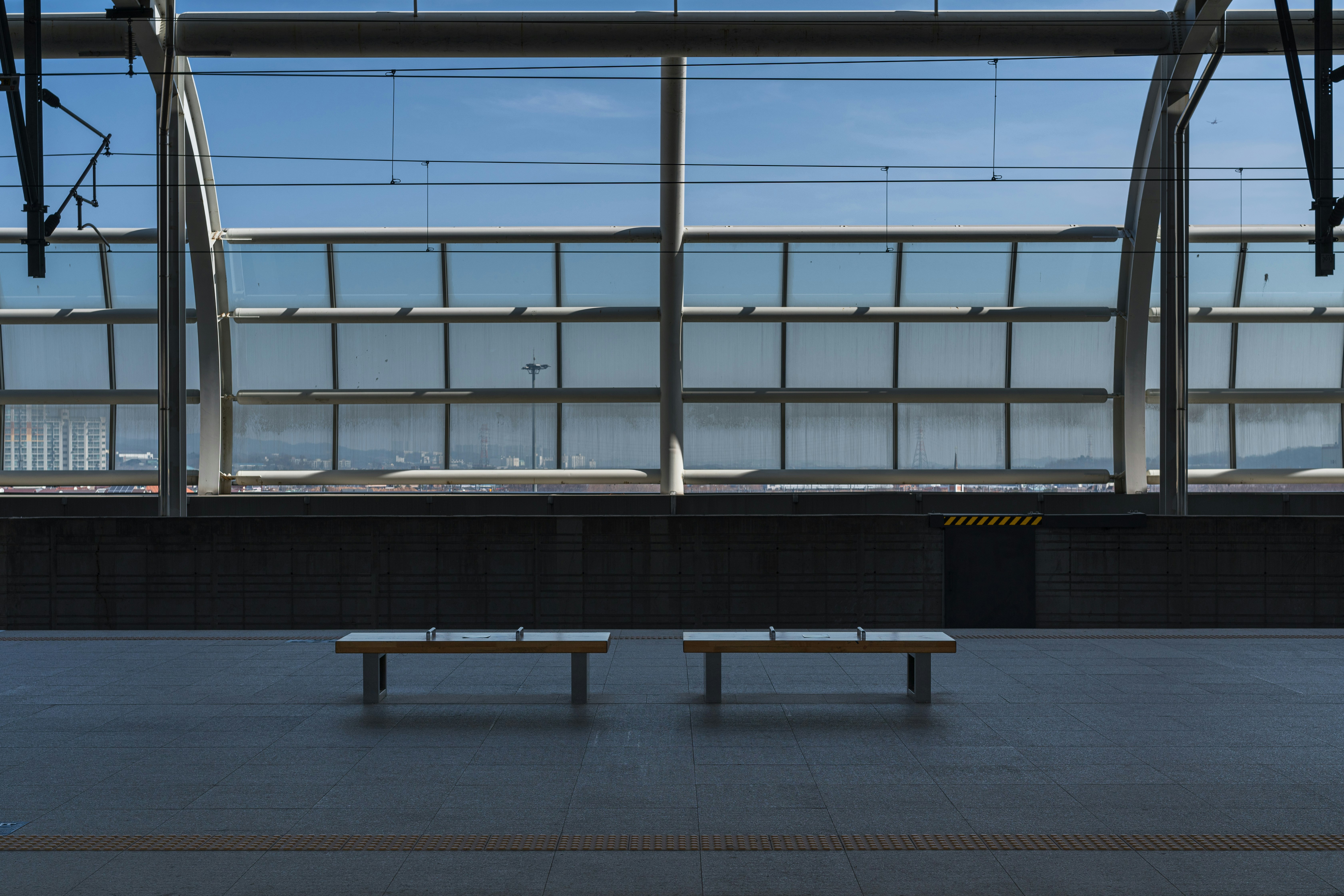 black wooden bench on gray concrete floor